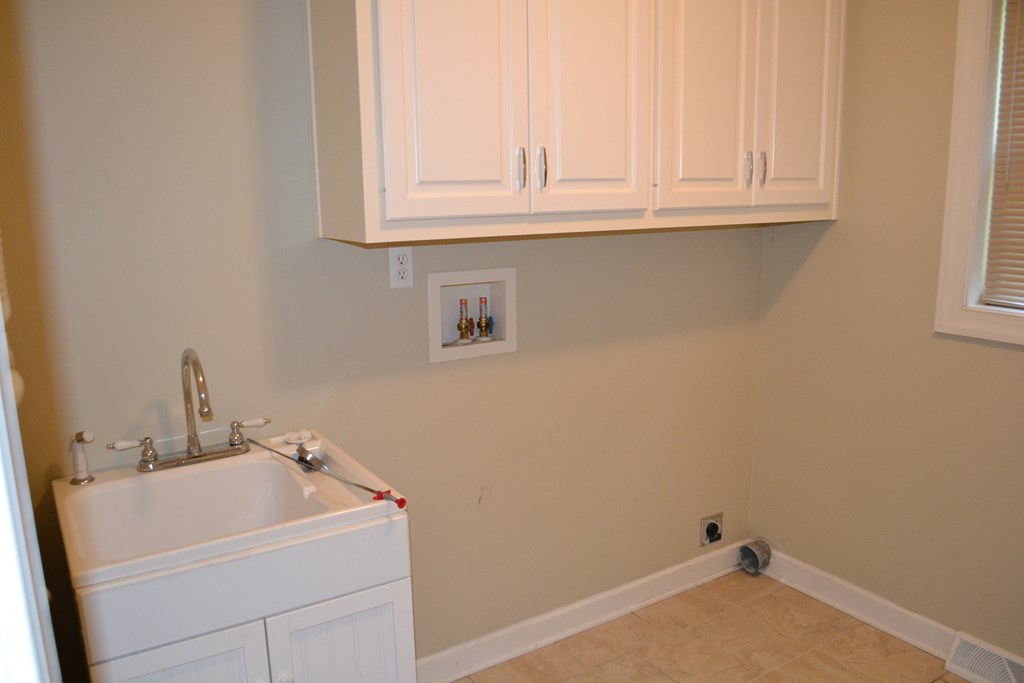 Utility with laundry sink and washer dryer hook up